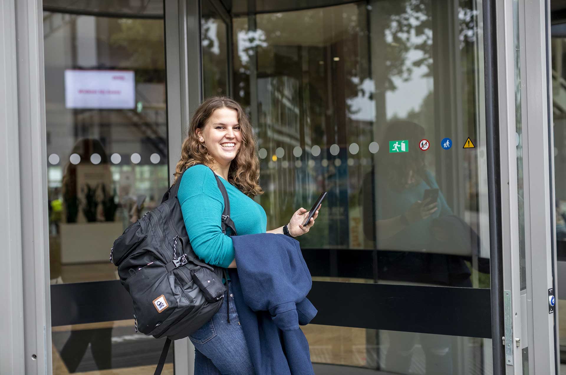 Student at the entrance of the campus